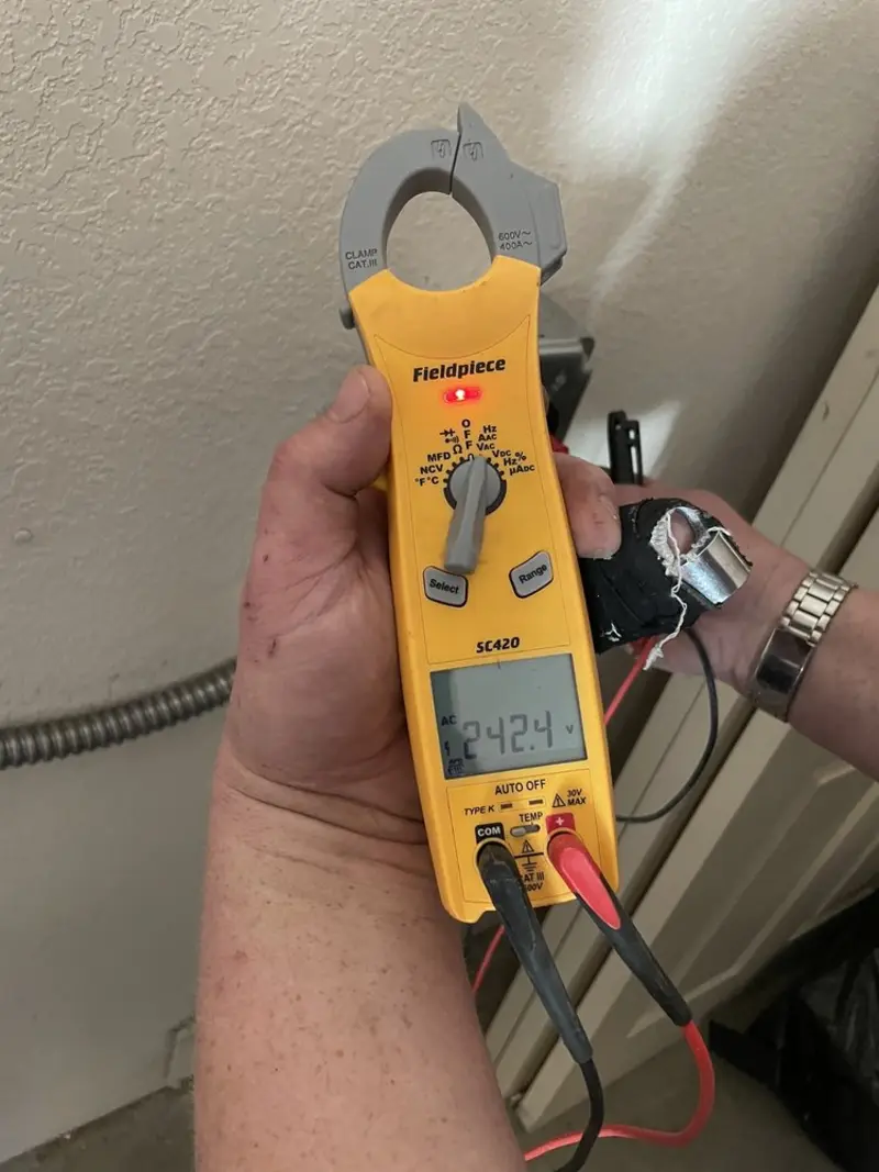 Voltage testing with clamp meter during Generator Installation in Grape Creek